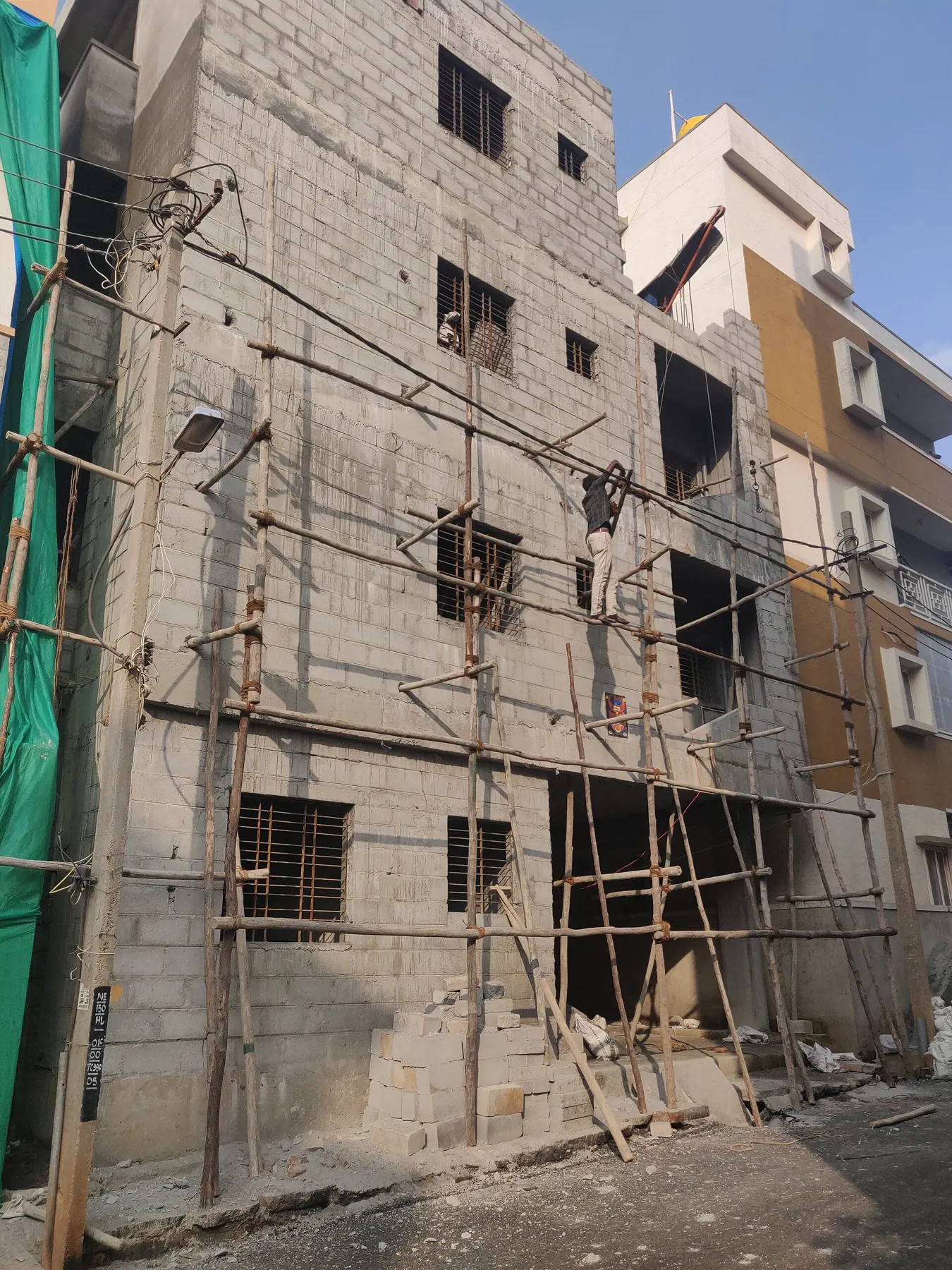 Building under construction with bamboo scaffolding